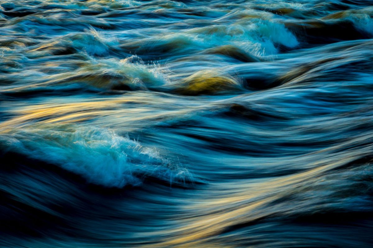 Arts sector appointments. A dynamic photograph of waves rising and falling as they roll forward towards the unseen shore.
