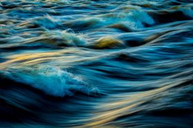 Arts sector appointments. A dynamic photograph of waves rising and falling as they roll forward towards the unseen shore.