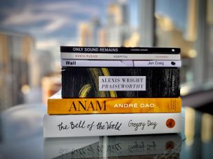 A stack of six books. The tiles on their spines can be seen: 'Only Sound Remains', 'Hospital', 'Wall', 'Praiseworthy' and 'Anam.'