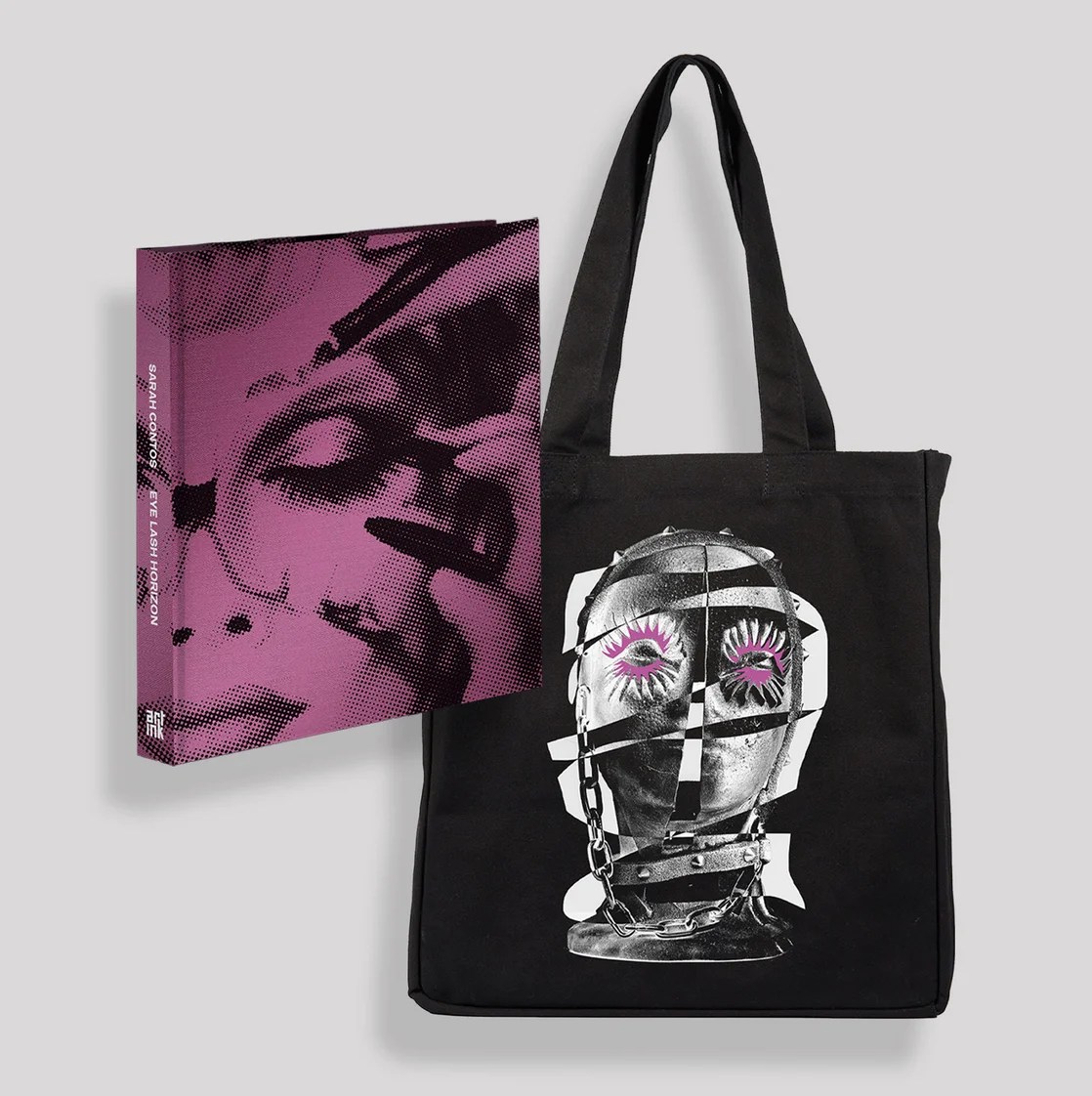 art book with pink cover and black tote bag
