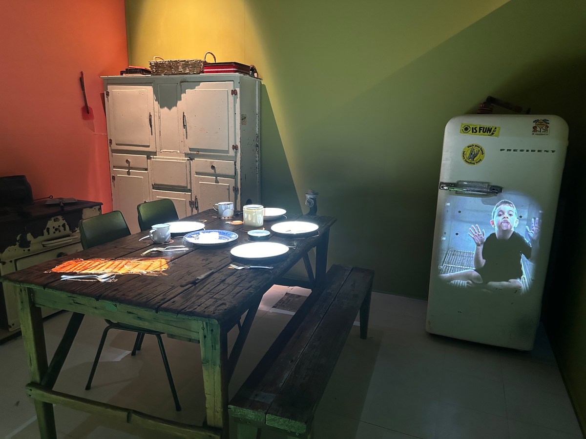 Art installation of vintage kitchen furniture and video projections. Archie Moore