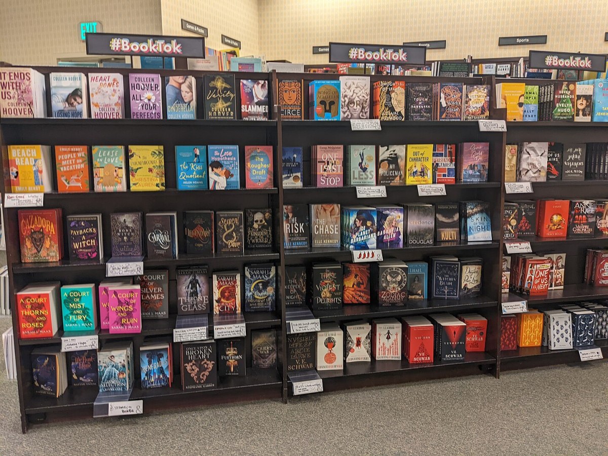 Shelves of books, with signs above reading BookTok