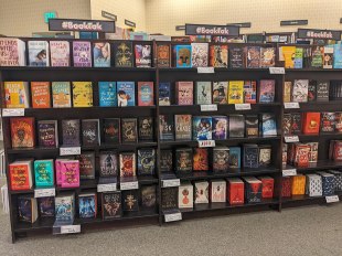 Shelves of books, with signs above reading BookTok