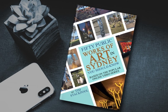 Promotional image of a book sitting on a table with a mobile phone. art bood