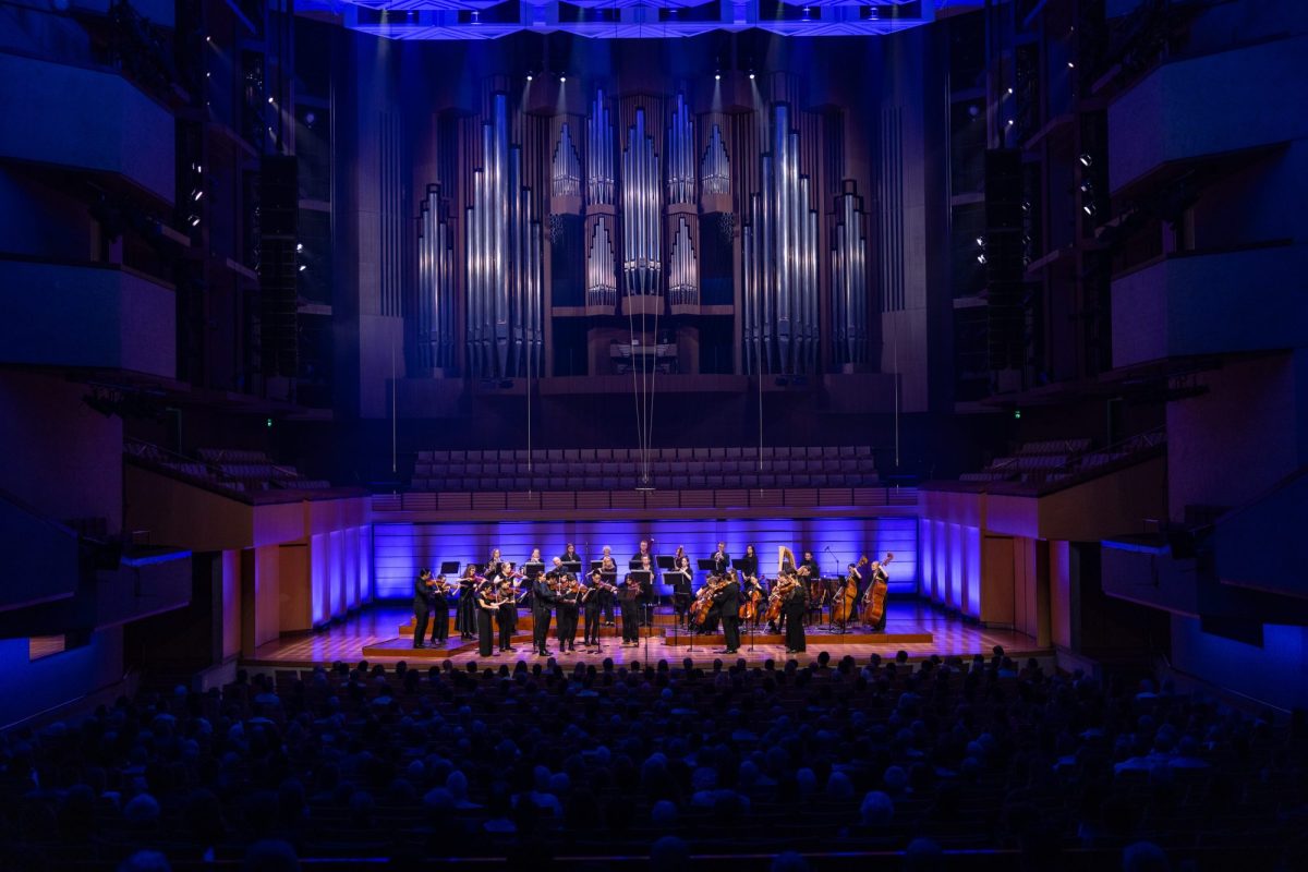 A classical concert with musicians on stage.
