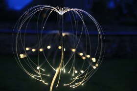 Detail of light installation in outdoors in early evening. Bruce Munro