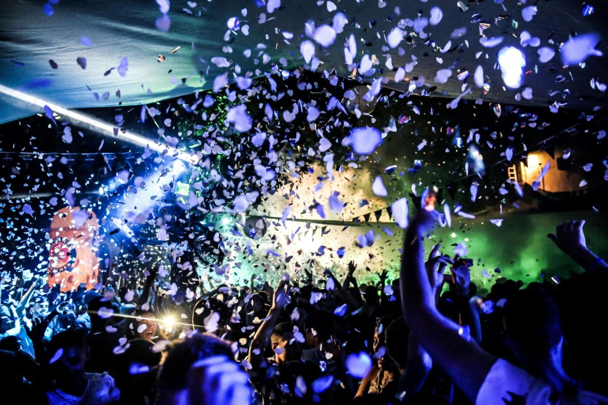 On the move is ArtsHub's weekly round-up of Australian arts appointments and resignations. The photo shows a crowd of people dancing at a rave party inside a nightclub.