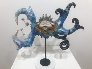 A blue sculpture with tentacles