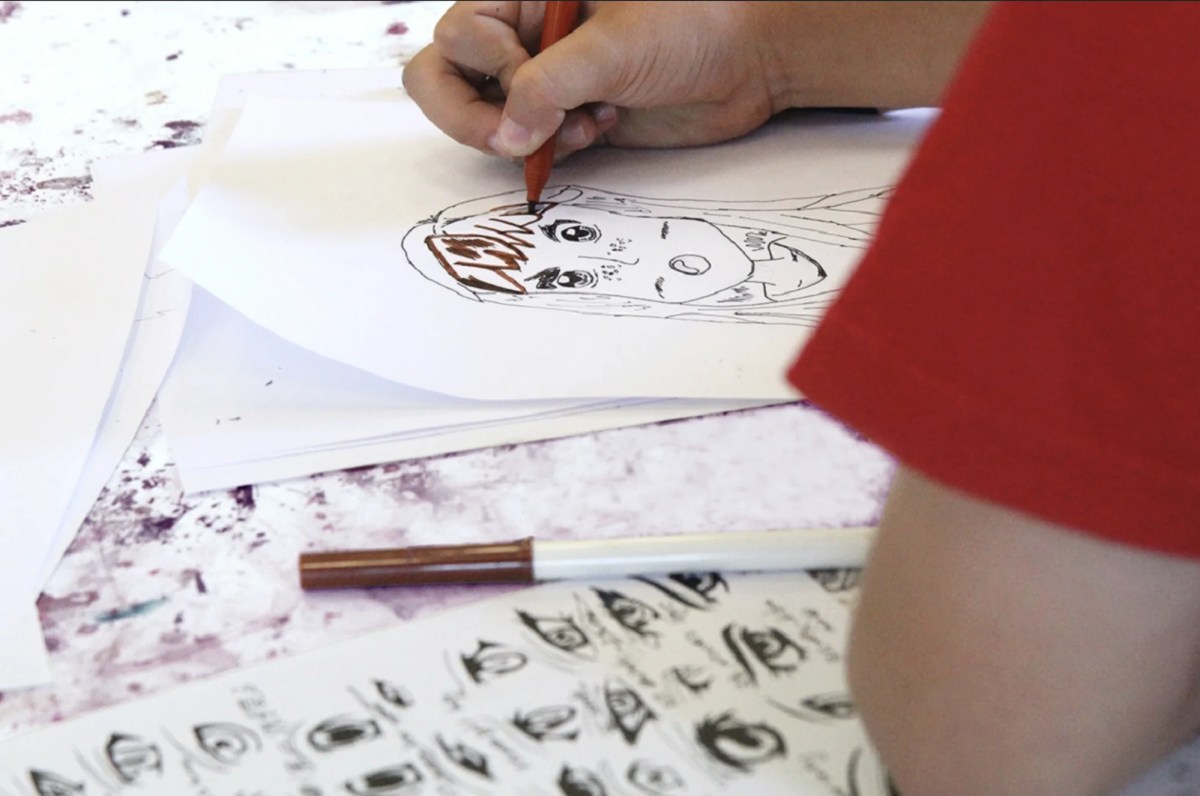 young person drawing anime. school holidays