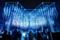 Outdoor light installation at night of hanging blue illuminated rods. Illuminate Adelaide