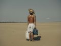 A finalist for the World Press Photo, Musuk Nolte's portrait shows a farmer carrying food across an Amazonian dried river bed. Image: Musuk Nolte.