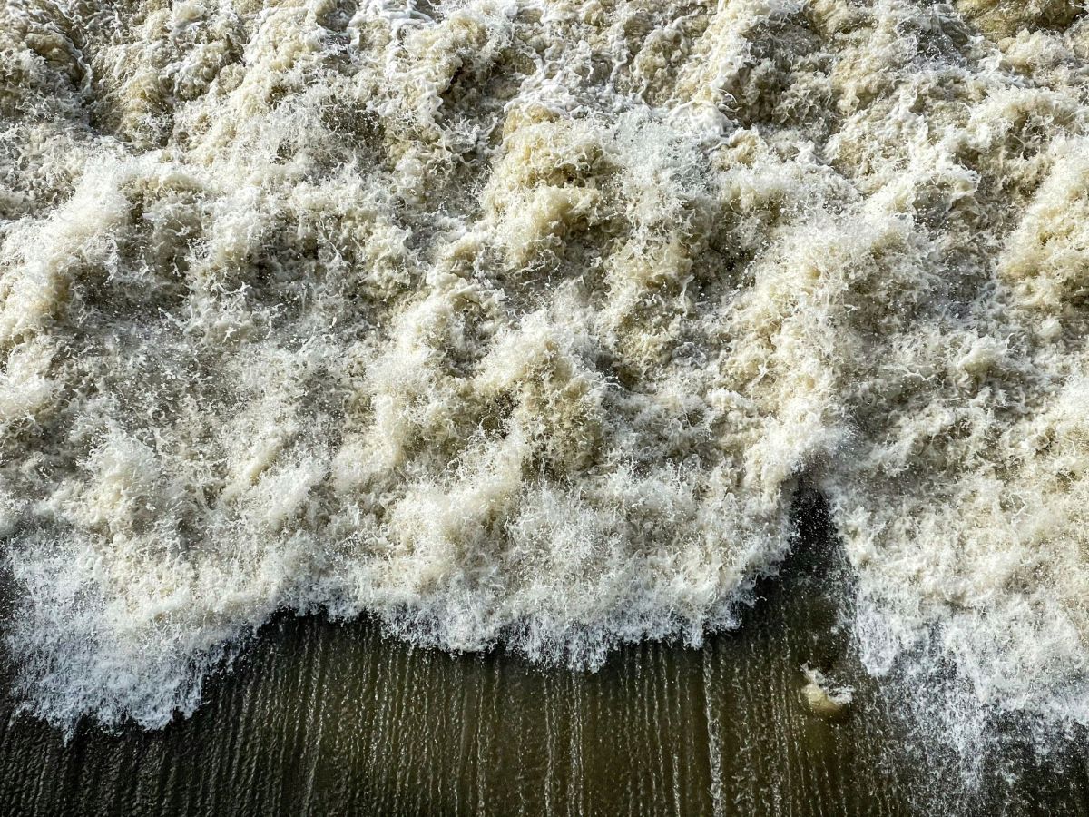 A close-up photo of waves crashing on a beach, illustrating ArtsHub's weekly On the move column, a wrap-up of arts sector appointments and departures.