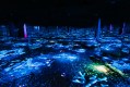 A dark room full of mirrors lit only by the colourful blue and yellow lights scattered in oceanic patterns across the floor.