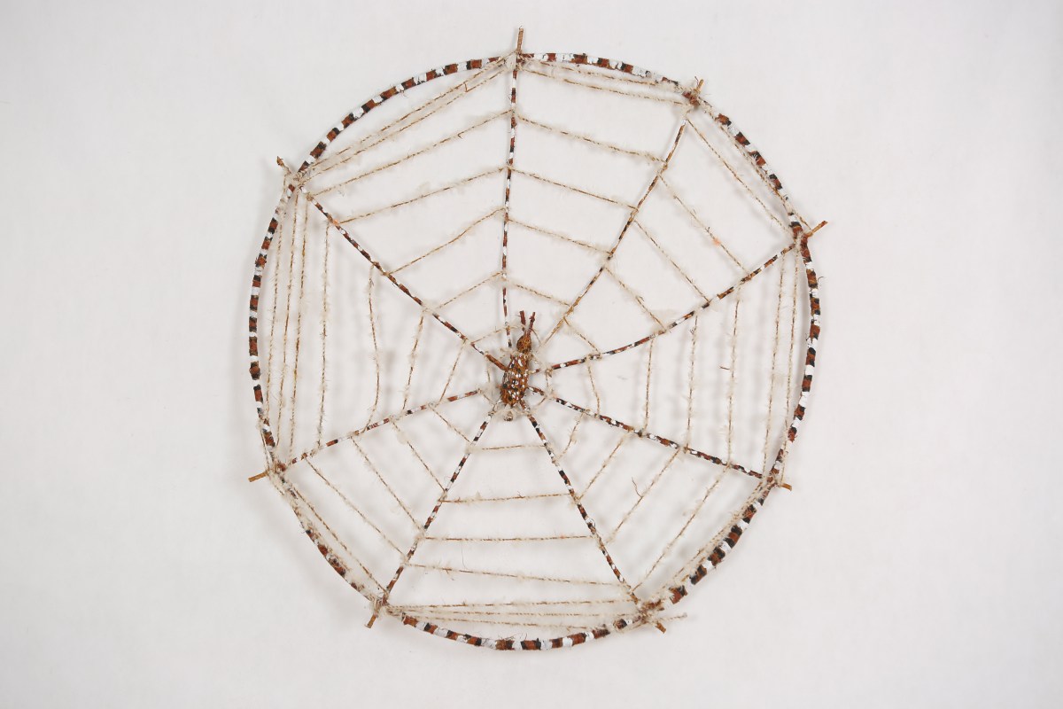 Fibre craft art in the shape of a spider web. 