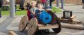 Two young boys in a vehicle made out of spare parts play as part of the DreamBIG Children’s Festival's Big Weekend at Adelaide Festival Centre.