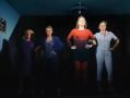 Four women standing with their hands on their hips. A scene from 'FEMME PLAY [ungrateful slut]', now showing at The Butterfly Club.