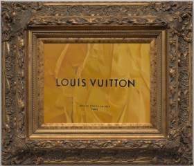 A painting enclosed within an elaborate gold frame with words 'Louis Vuitton' depicted in the artworks' centre. Showing as part of the exhibition 'Tracey Jones: Cultural Baggage' at CBD Gallery, Sydney.