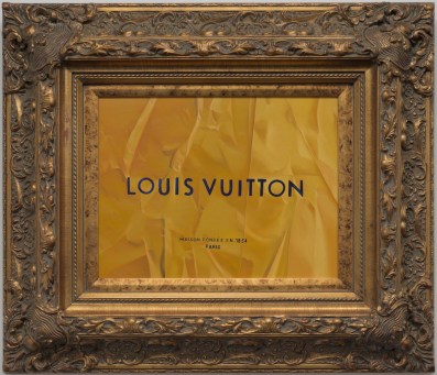A painting enclosed within an elaborate gold frame with words 'Louis Vuitton' depicted in the artworks' centre. Showing as part of the exhibition 'Tracey Jones: Cultural Baggage' at CBD Gallery, Sydney.