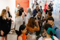 crowd gathered at exhibition opening. ADC