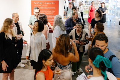 crowd gathered at exhibition opening. ADC