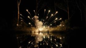 An explosion: bright yellow sparks in the dark.