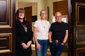 Three people standing for portrait. Mordant major gift
