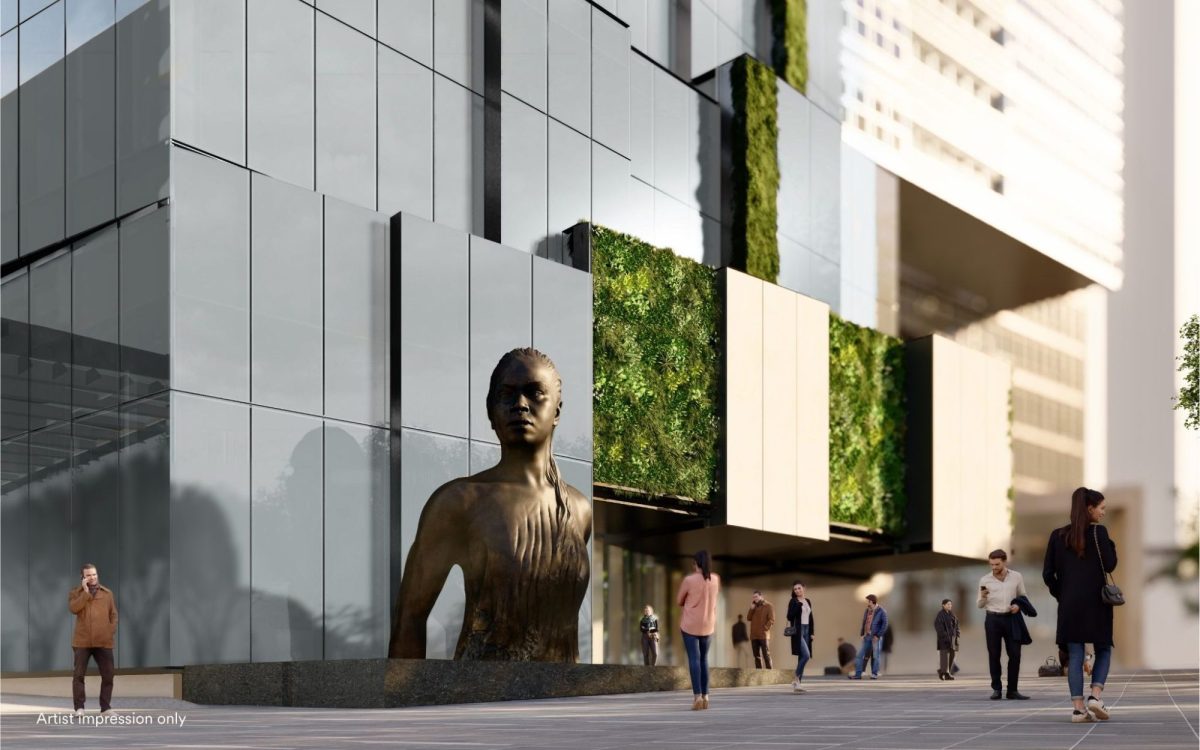 A digital render of a large bronze sculpture of a woman emerging out of the water, only showing the top half of her body, in a public space next to a building.