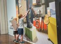 Two small children doing art activities. Regional galleries