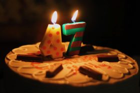 The numbers 47 in candles on the top of a cake
