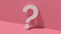 A white question mark against a pink background.