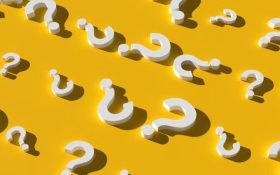 A series of white question marks in different directions against a yellow background.