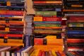 A stack of colourful books, possibly written by Australian writers.