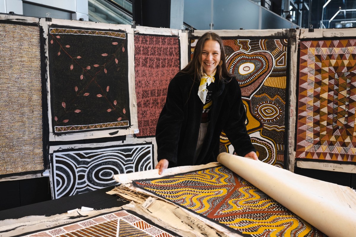 Women in art expo setting showing Aboriginal Art. NAIDOC