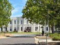 Georgian style building in leafy university campus. ANU School art and design