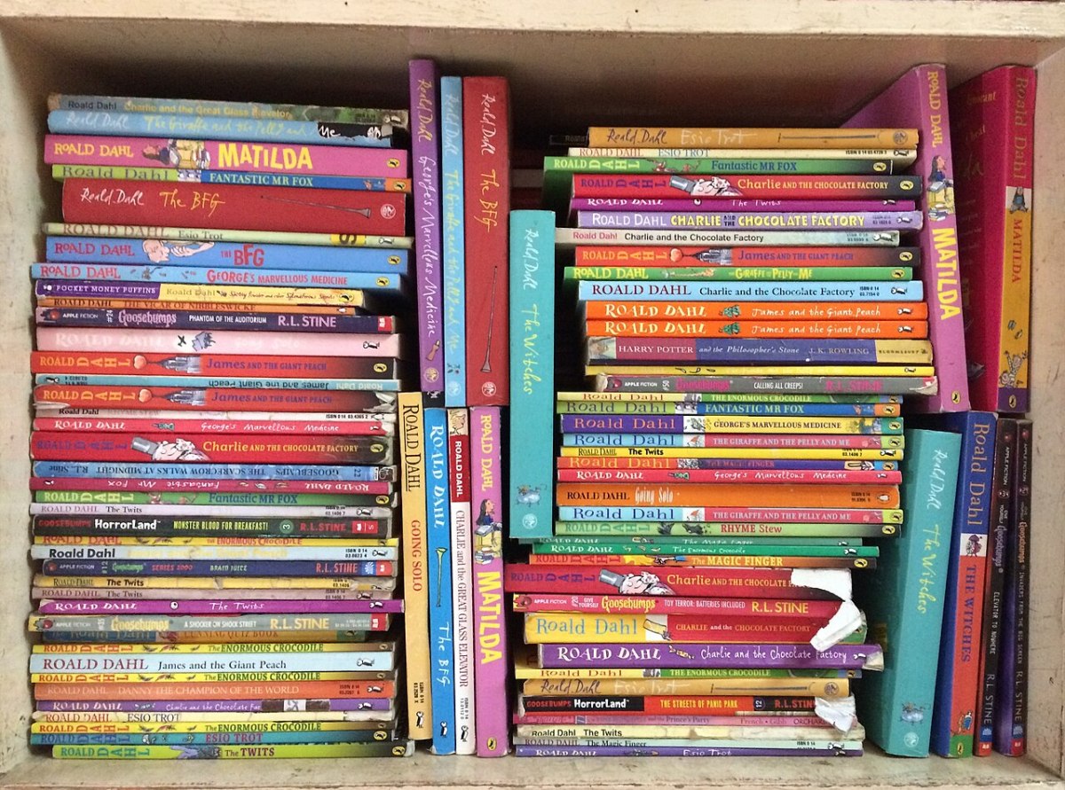 a bookshelf full of books by Roald Dahl.