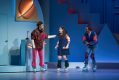 Two women and a man in colourful clothes on roller skates. Kimberly Akimbo