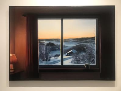 A window within a window look at a snowy landscape.