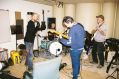 The four members of Eddy Current Suppression Ring rehearse in a nondescript band room.