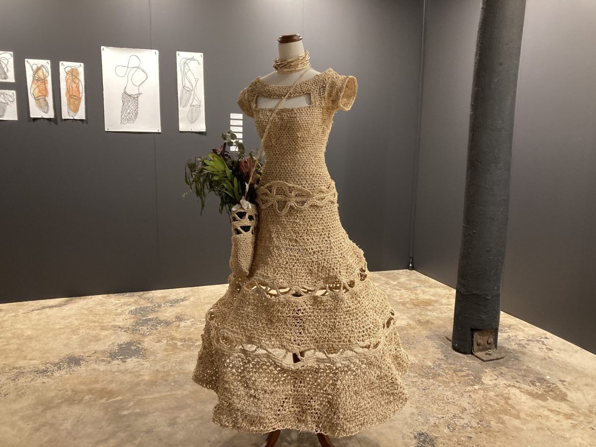 Straw woven dress on stand. 'Unconstitutional Love' by Kyhra Manck. Among the artist's prize-winning full body of work, CIAF 2025 Art Awards. Installation view.