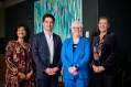 Regional Arts WA Minderoo Foundation: a portrait style photograph of four people: left to right: person 1 is female in her fifties with dark long hair, person 2 is male in his forties with short dark hair, person 3 is a female in her sixties with short white hair and classes, person 4 is female in her forties with long light brown hair.