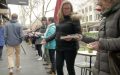 Photo of people passing books outdoors in the winter to help Hill of Content relocate their bookshop.