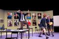 A classroom scene in Trophy Boys, with three students. One is standing on a table.