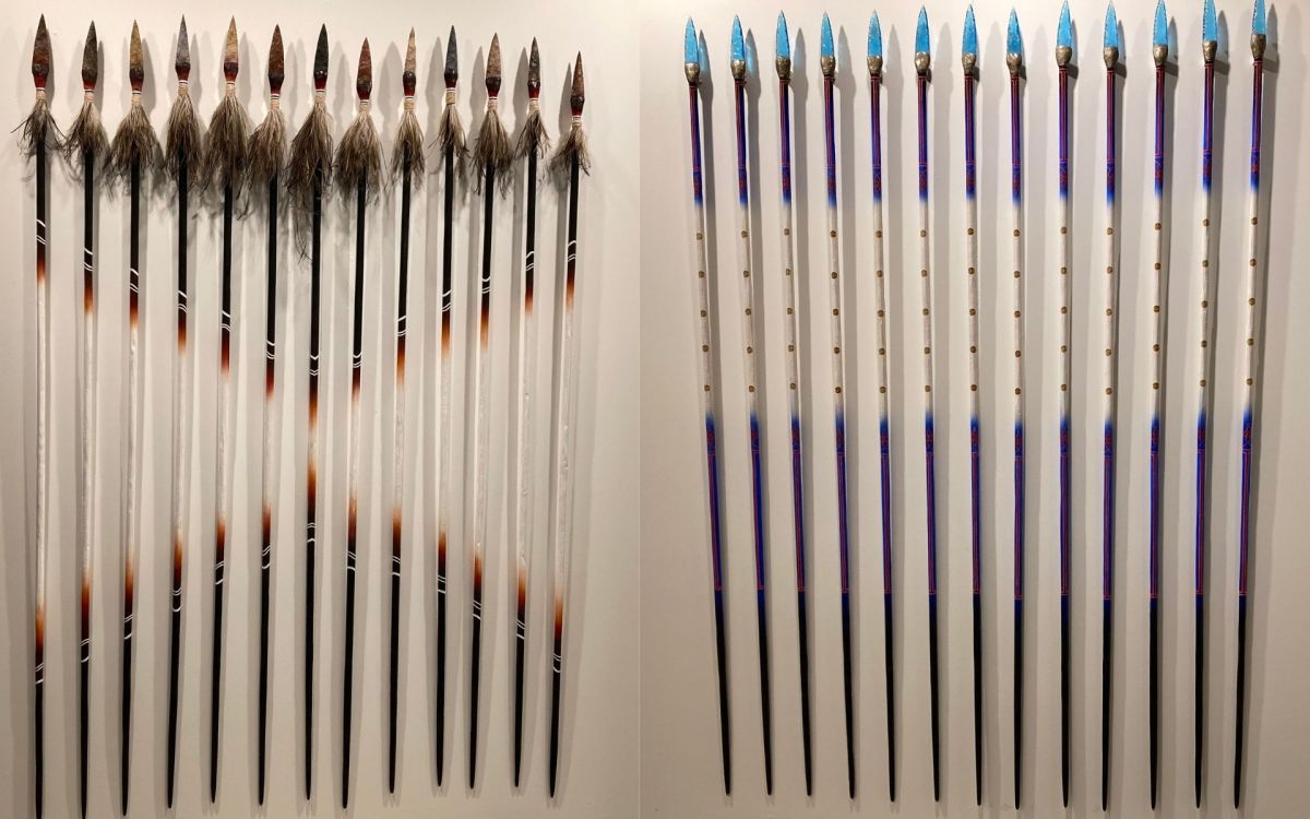 Spears by Dylan Sarra. L-R: 'Stone Tipped Spears', #1 (2025) eucalypt, jasper stone, acrylic, emu feathers, cotton tree and resin, 210 x 6 cm. 'Glass-Tipped Spears' (Native Police) #1 (2025), eucalypt, acrylic, grass tress resin and hand knapped glass 210 x 6 cm. CIAF 2025 Art Fair Showcase, installation view. Photos: ArtsHub. CIAF 2025 Art Fair Showcase