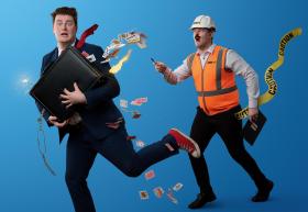 A man with a stuffed suitcase of playing cards running away from another man in an orange high vis vest.