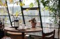 At this death café, a small table is by a large window.