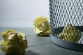 A wastepaper basket with scrunched up paper, symbolising grant rejection.