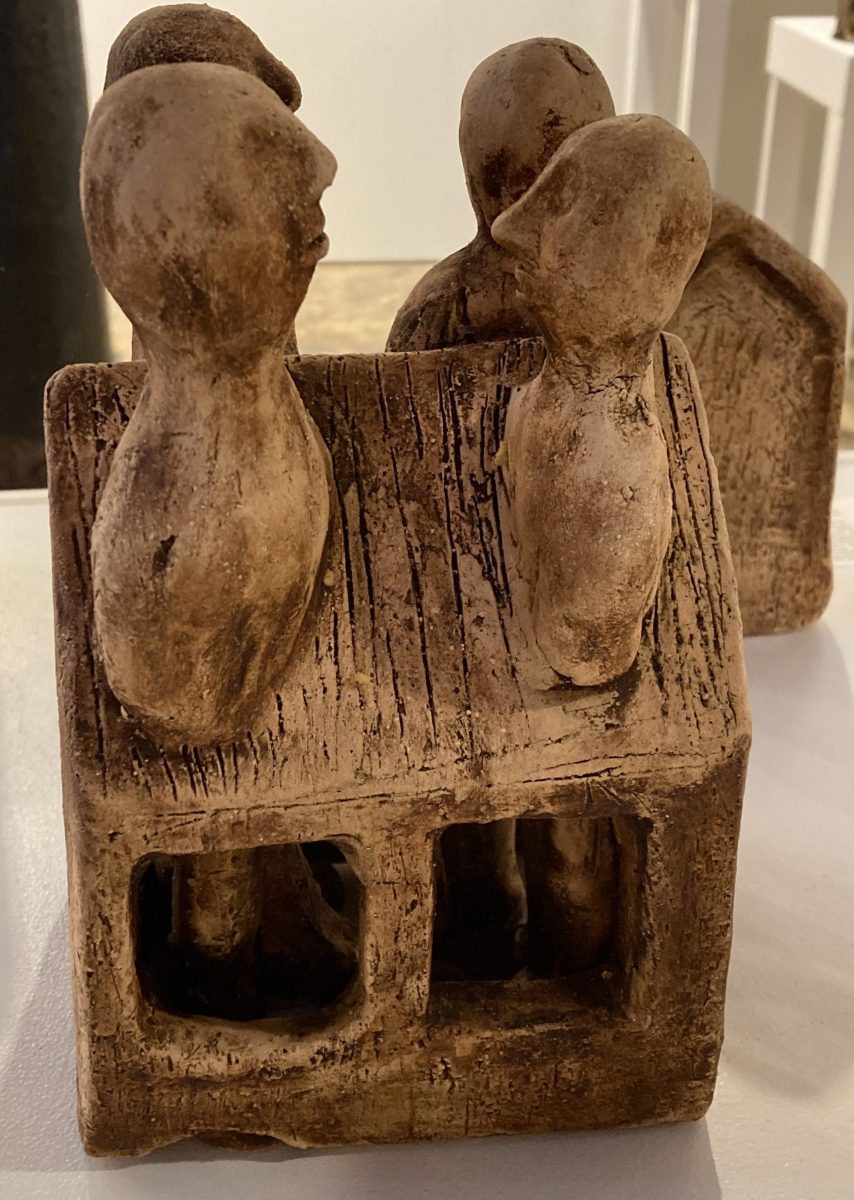 'Under One Roof' (by Michelle Yeatman. CIAF 2025 Art Fair Showcase, installation view - ceramic house with four heads popping out of the roof