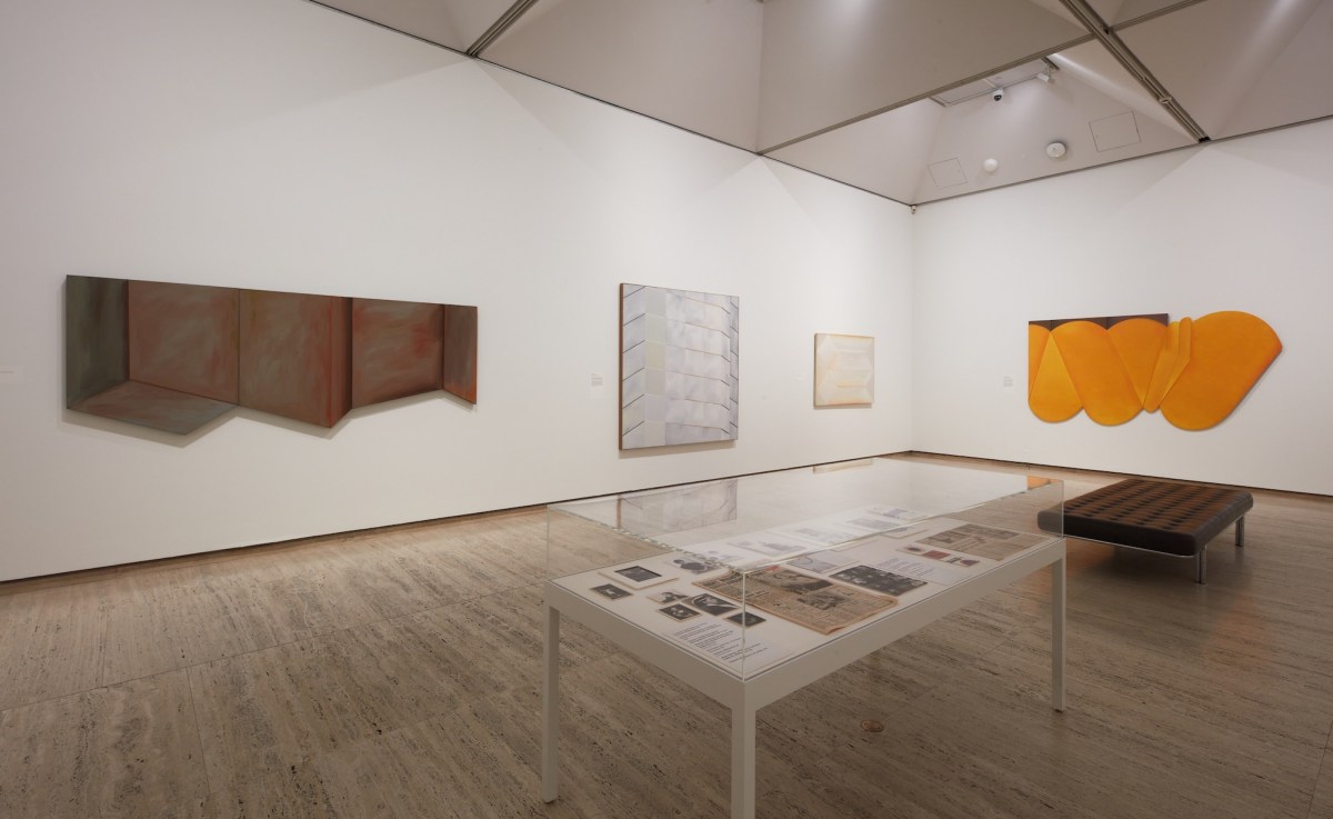 Gallery view with 1970s shaped paintings. Janet Dawson