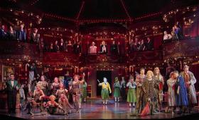 Large cast scene in La La Bohème.