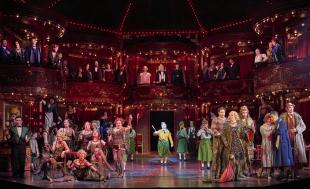 Large cast scene in La La Bohème.